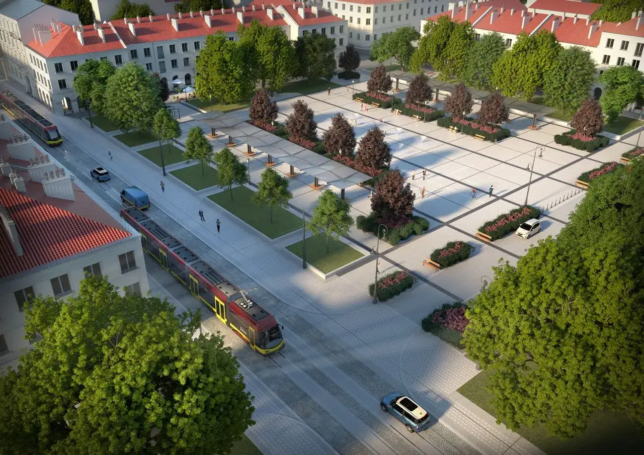 Nowoczesny plac w Łodzi stare miasto z tramwajami, samochodami i zielenią.