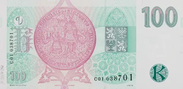 Czeska korona 100. Na banknocie widnieje pieczęć z rycerzem i królem, herb Czech i nominał. Za 100 koron czeskich można kupić np. kilka kaw.